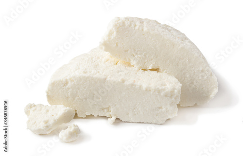 homemade Adyghe cheese cut into pieces isolated on a white background