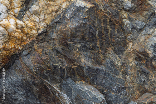 Gold ore texture close-up. Contains quartz, mica, feldspar, chlorite, garnet, carbonate, sulfides and gold.