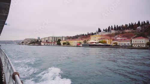 View of the coast of Istanbul from a floating ship on a cloudy day