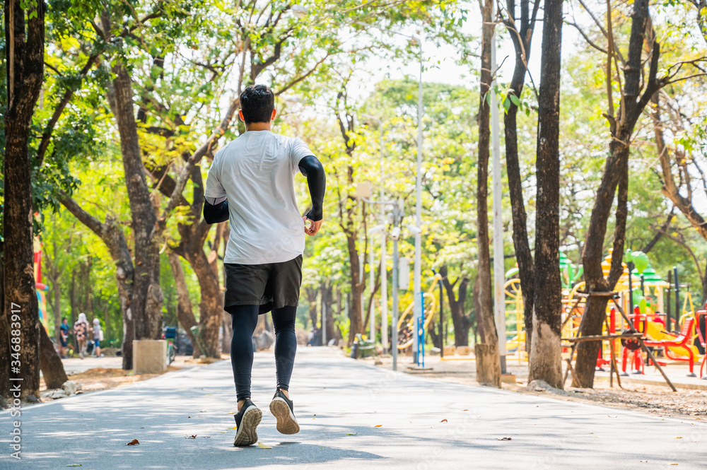 Handsome Healthy runner jogging outdoor. Fitness and sport healthy lifestyle concept.