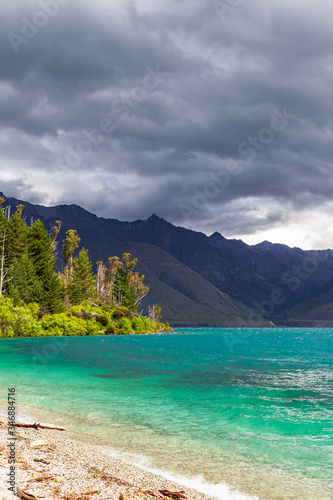 Mountain peaks above the turquoise. Lake Wakatipu, New Zealand