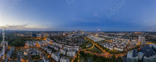 Aerial drone panorama of Frankfurt skyline during sunset from Rebstock park © Aquarius