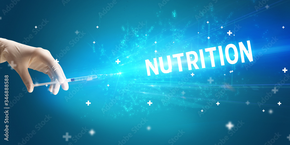 Syringe, medical injection in hand with NUTRITION inscription, medical antidote concept Syringe, medical injection in hand with NUTRITION inscription, medical antidote concept