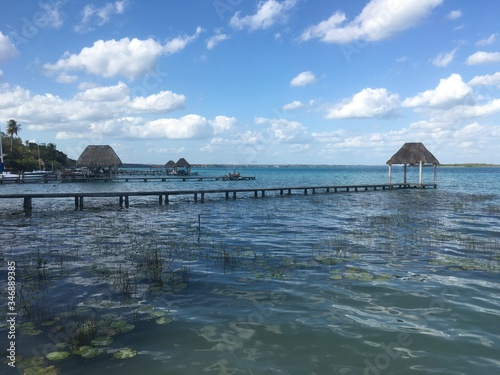 Beautiful ocean view with clean blue turquoise water, sunny day. Amazing background of island, Caribbean, Lagoon Bacalar. Calm secluded place without people, paradise