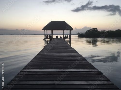 Beautiful ocean view with clean water, evening or night Amazing background of island, Caribbean, Lagoon Bacalar. Calm secluded place. people meet the damn or sunset, paradise