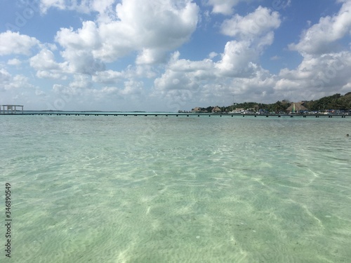Beautiful ocean view with clean blue turquoise water, sunny day. Amazing background of island, Caribbean, Lagoon Bacalar. Calm secluded place without people, paradise