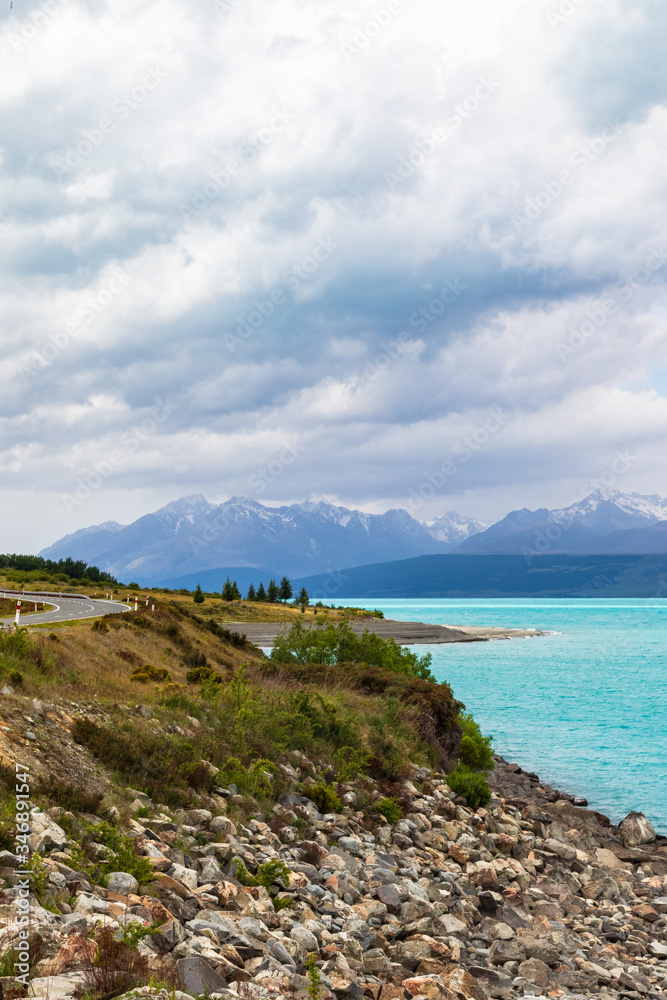 Mountains over turquoise water. Path to Mount Cook, New Zealand