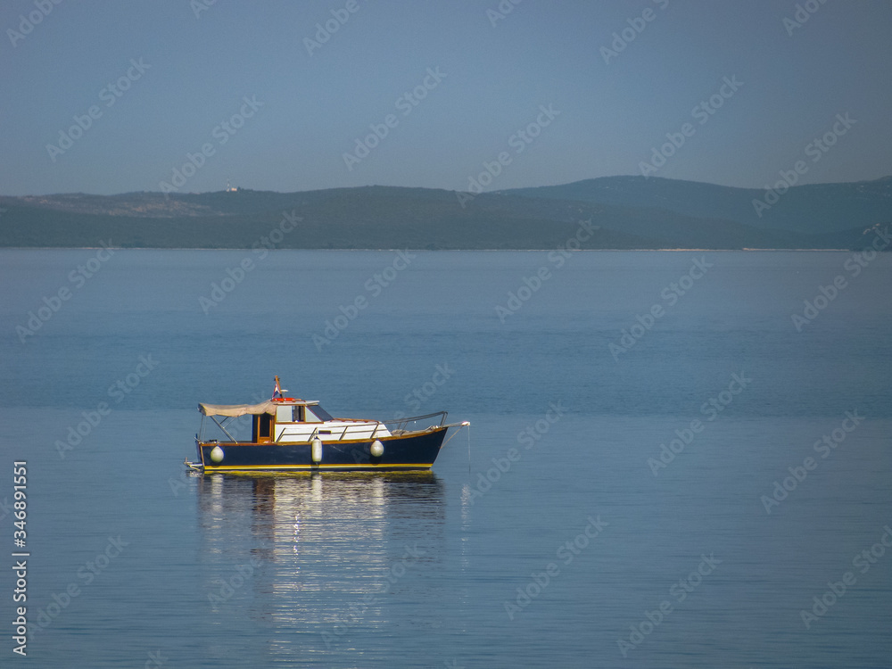 small ship in the middle of the sea. sea voyage. small ship in the middle of the sea. sea voyage.