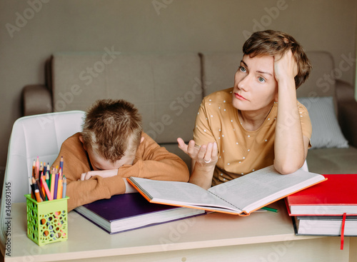 Mother teaches child son home online education