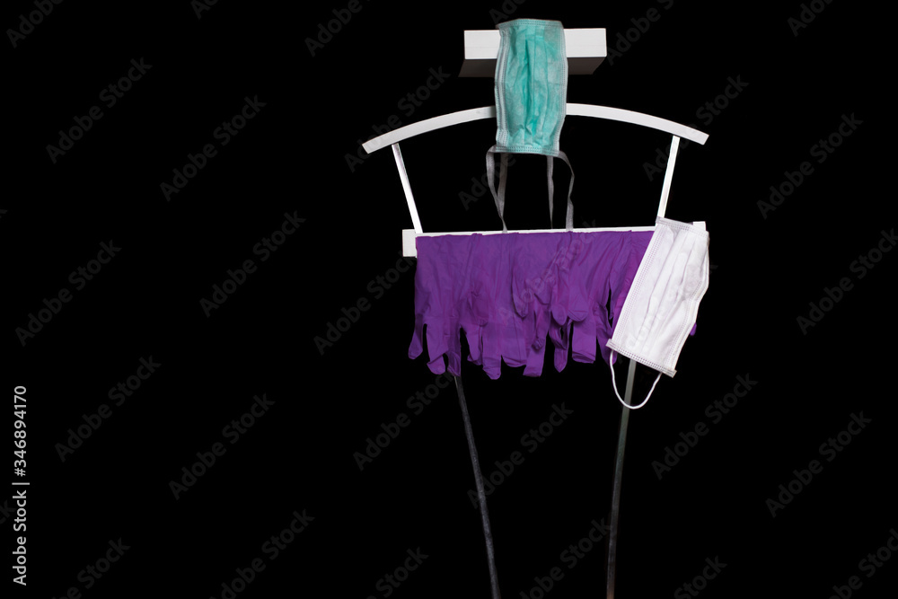 Clothes hanger with purple gloves and mask. The only thing you need for covid19. Clothes hanger with purple gloves and mask. The only thing you need for covid19.