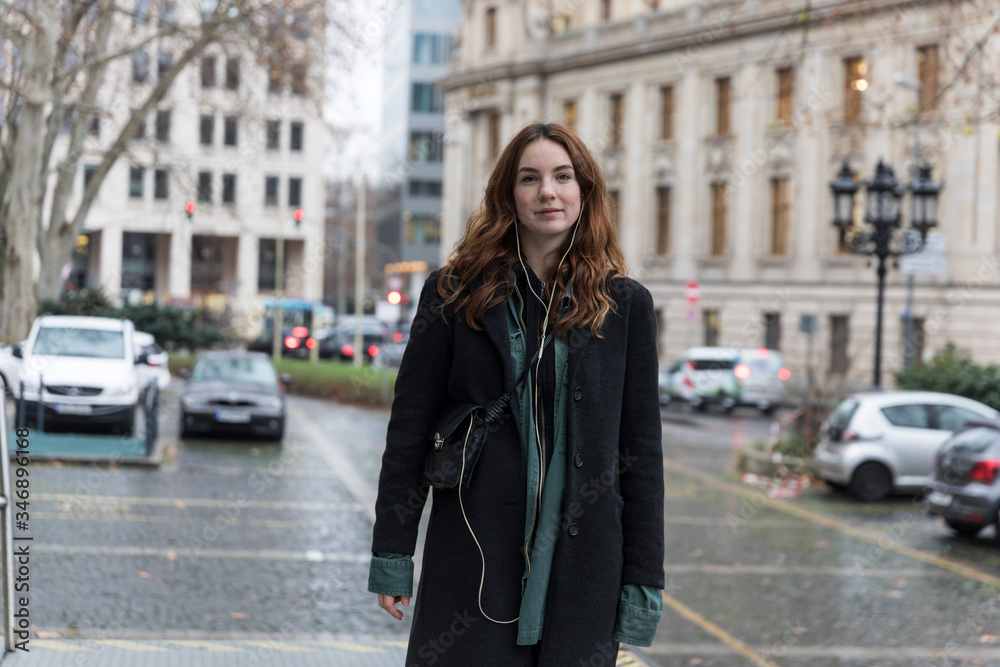 Young Woman Wearing Black Coat Posing in City Young Woman Wearing Black Coat Posing in City
