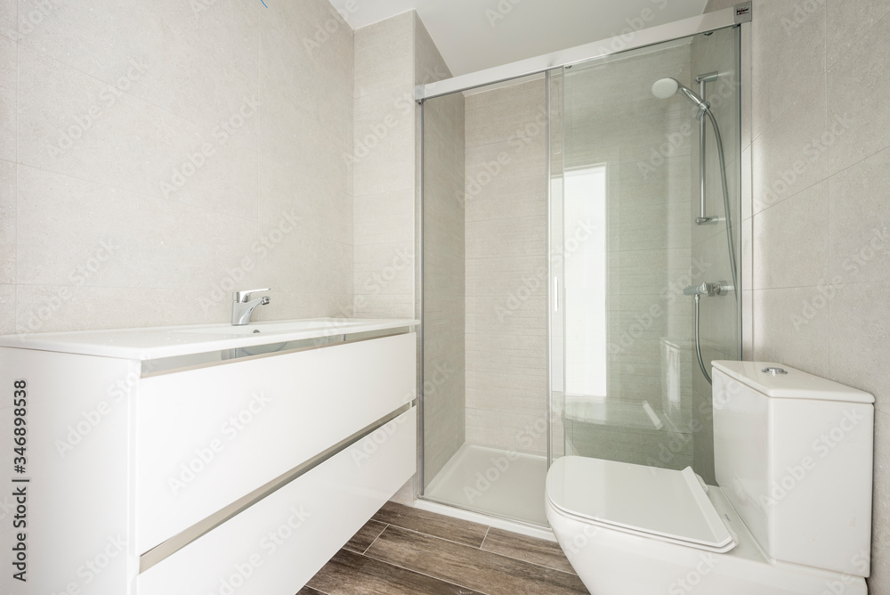 Light-toned bathroom with shower Light-toned bathroom with shower