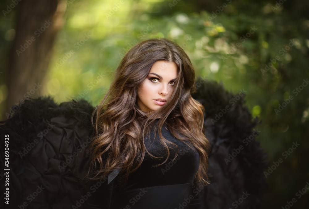 Portrait of brunette pretty girl with angel's wings Portrait of brunette pretty girl with angel's wings