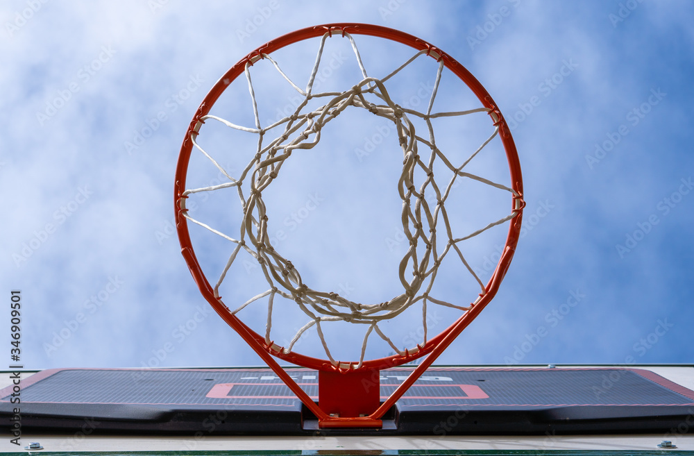 basketball hoop on blue sky background