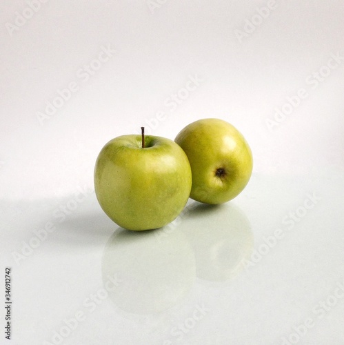 green apples on a white background