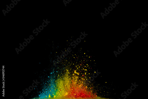 Colored powder explosion. Abstract closeup dust on backdrop. Colorful explode. Paint holi..d....