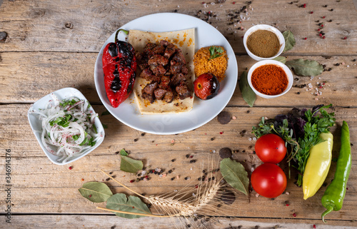 Kebab - grilled meat and vegetables. Shish kebab on skewers with onions. middle eastern cuisine. 