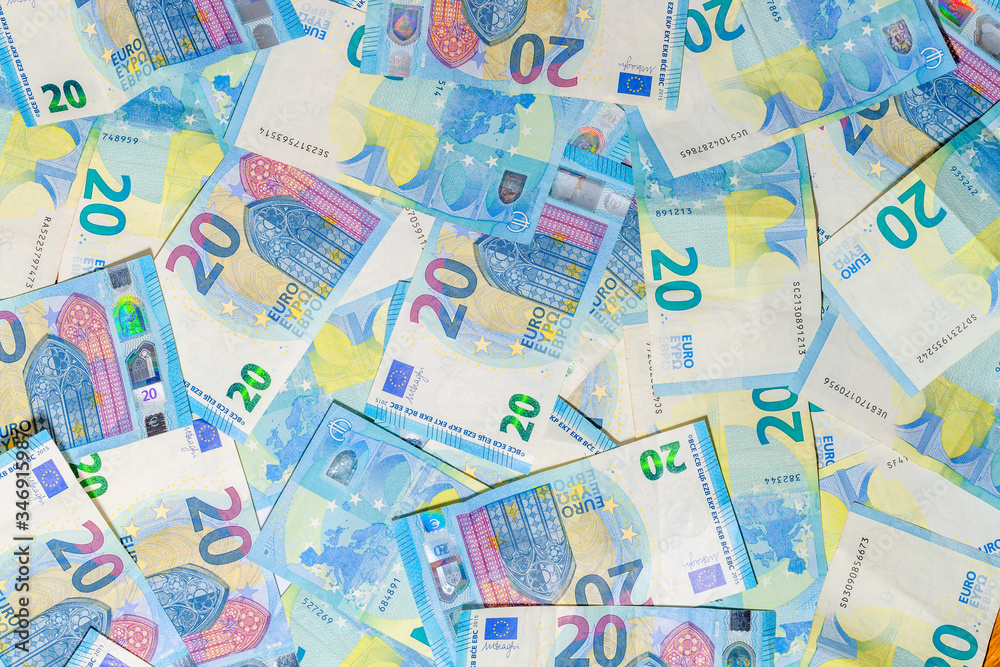 Twenty Euro banknotes background of Euro currency in Europe. Financial colorful background. Concept of printing money from the European mint and the European Central Bank ECB.