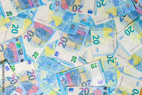Twenty Euro banknotes background of Euro currency in Europe. Financial colorful background. Concept of printing money from the European mint and the European Central Bank ECB. photo