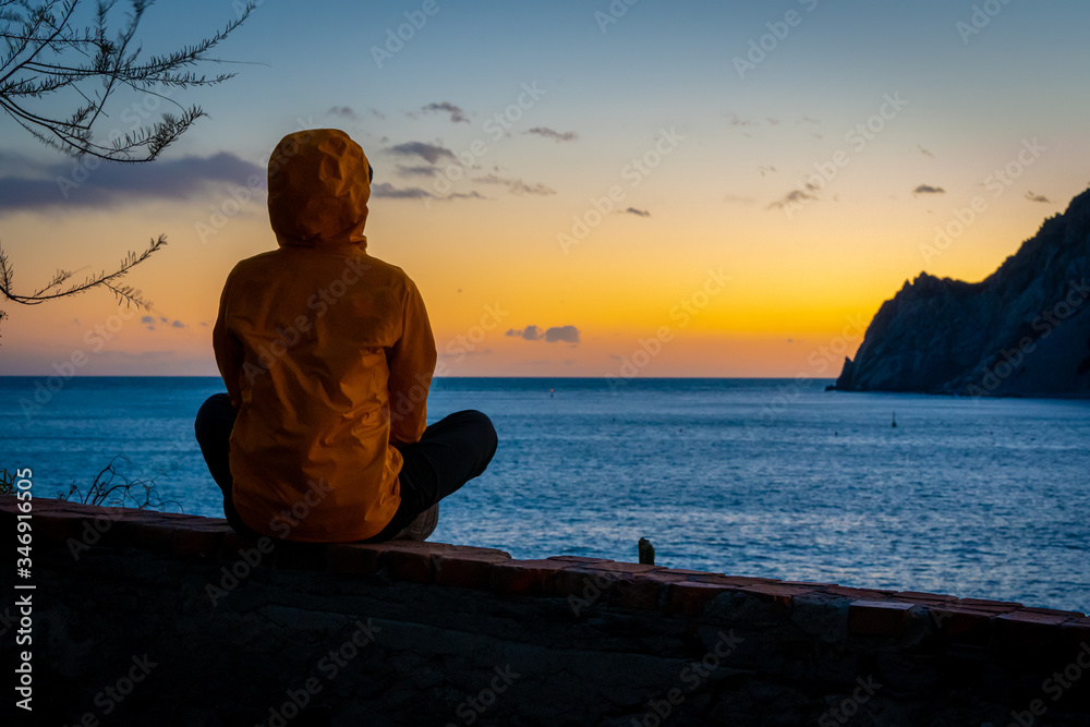 man watching the sunset over the sea, Cinque Terre, Liguria, Italy, Monterosso al Mare