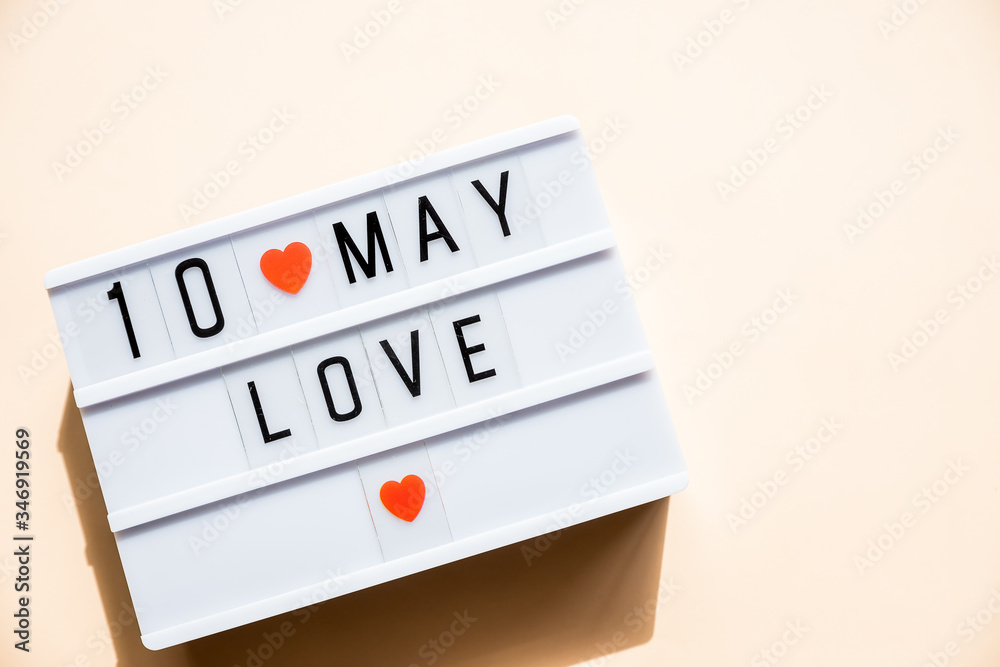 May 10th Mothers Day card with small red hearts on pastel background. holiday, greeting card. Mother's day concept.Best mom ever May 10th Mothers Day card with small red hearts on pastel background. holiday, greeting card. Mother's day concept.Best mom ever