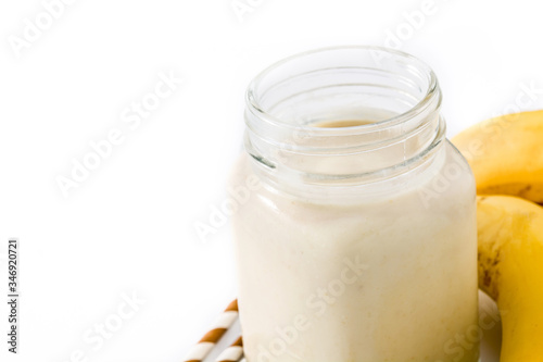 Banana smoothie with almond in jar isolated on white background. Copy space
