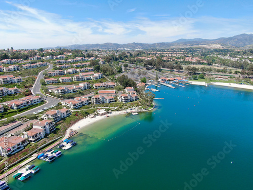 Aerial view of Lake Mission Viejo, with recreational facilities, surrounded by private residential and condominium communities. Orange County, California, USA