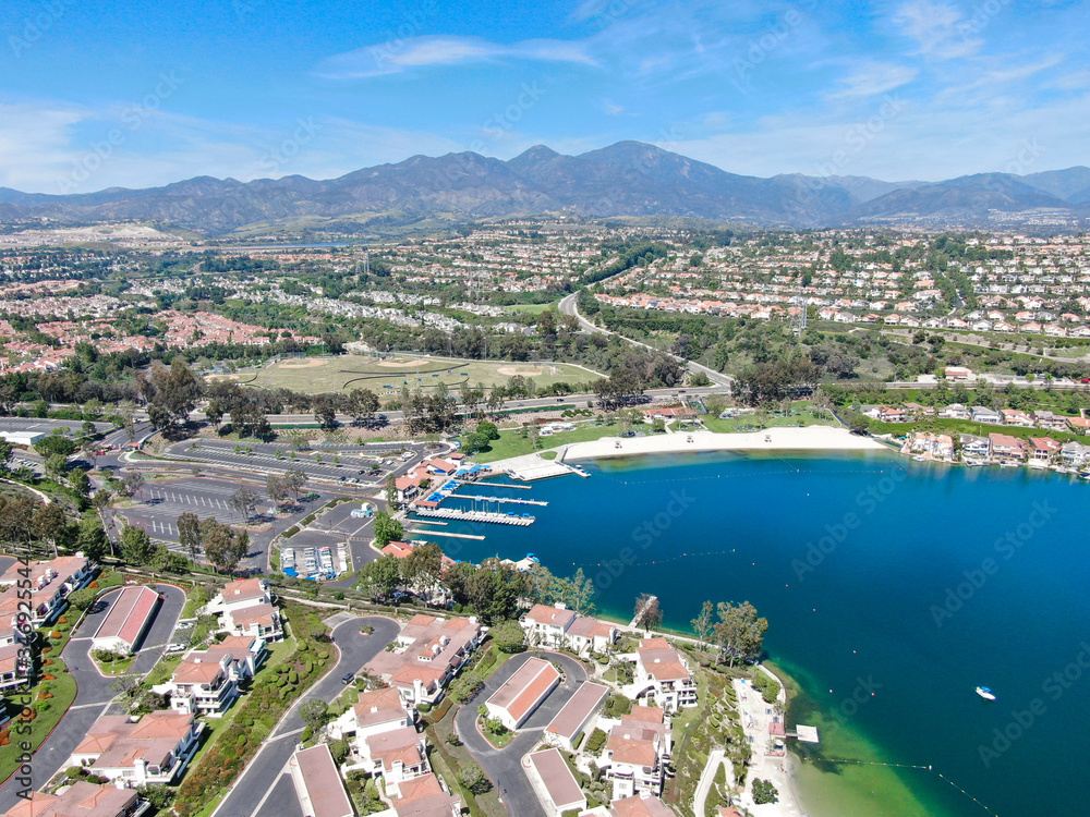 Aerial view of Lake Mission Viejo, with recreational facilities, surrounded by private residential and condominium communities. Orange County, California, USA