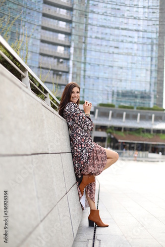 smile in modern city with flower dress