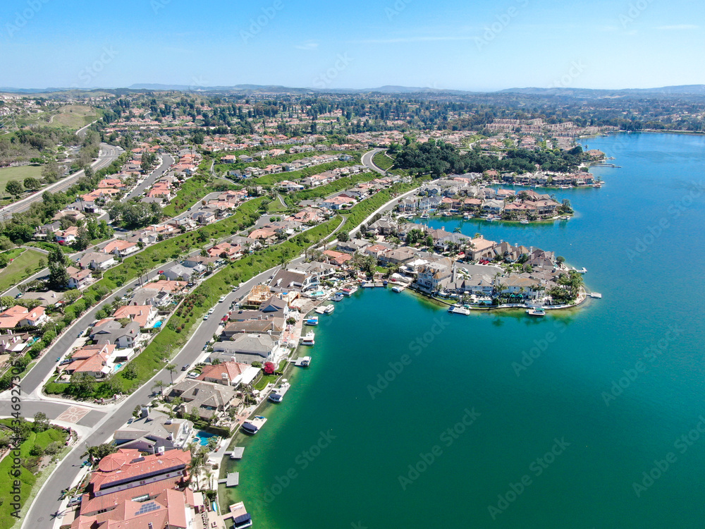 Aerial view of Lake Mission Viejo, with recreational facilities, surrounded by private residential and condominium communities. Orange County, California, USA