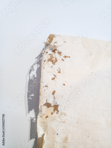 Paper swallowed with silverfish. Traces of wrecking silverfish on vinyl envelopes. photo