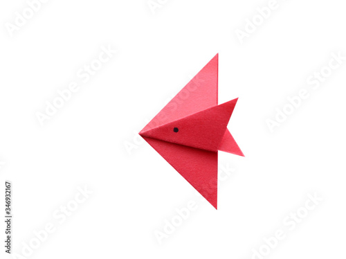 A red origami fish isolated white