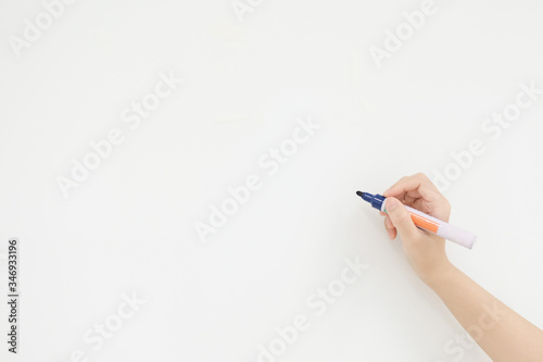 Teacher and blue pen on white board