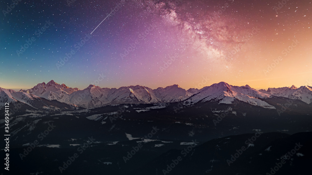 Naklejka premium Snowy rocky mountain with a beautiful starry night, space fort text