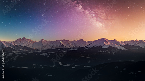 Snowy rocky mountain with a beautiful starry night, space fort text
