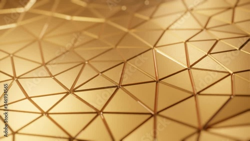 Abstract triangles gold pattern loop background with shinny gold material texture in luxury premium style for product presentation or music video background.