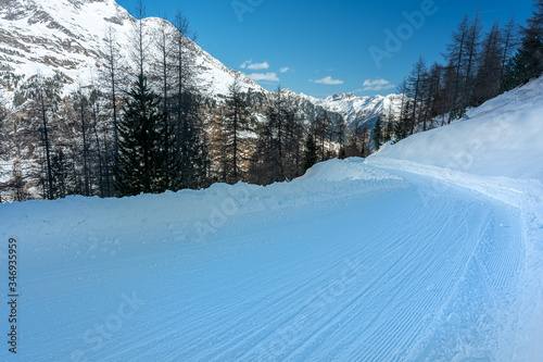 empty snow sled track, mountain © Davide Marconcini