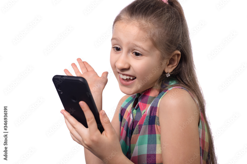 Cute little girl using mobile phone on white background. Cute little girl using mobile phone on white background.