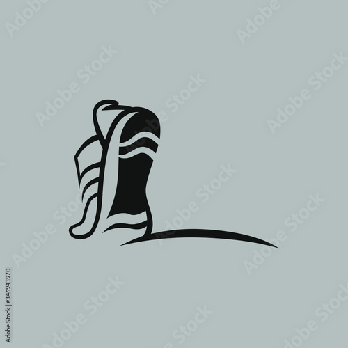 Abstract running shoe symbol on gray backdrop. Design element