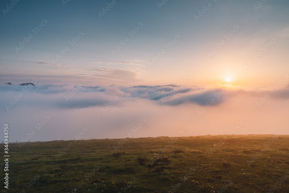 Fototapeta premium Over The Clouds At Sunset