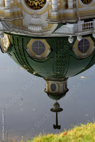 Old pavilion water reflection. Kuskovo public park in Moscow. Popular landmark.