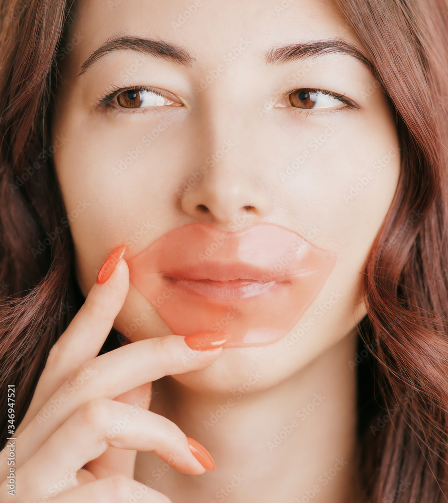 Beautiful woman with hydrogel moisturizing patch on her lips. Beautiful woman with hydrogel moisturizing patch on her lips.