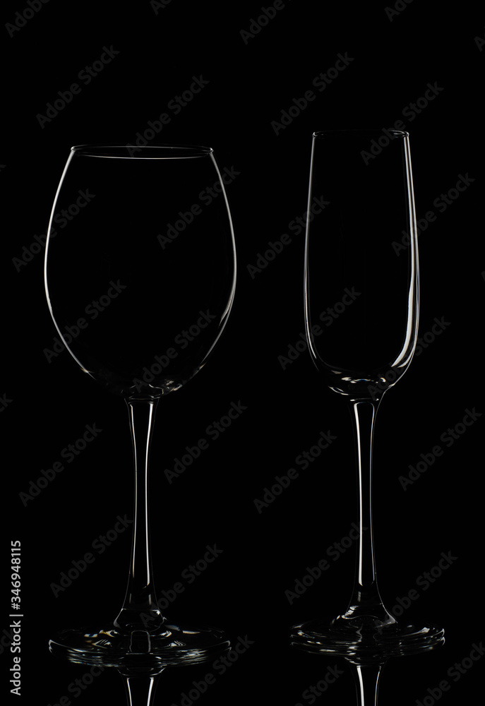 Empty glass wine glasses on a dark background