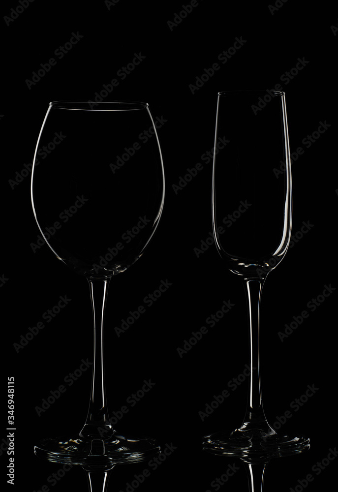 Empty glass wine glasses on a dark background Empty glass wine glasses on a dark background