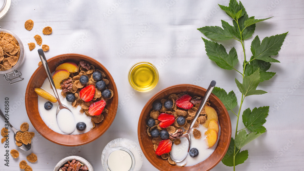 Health plate cereal with strawberries and yogurt on a white tablecloth Health plate cereal with strawberries and yogurt on a white tablecloth