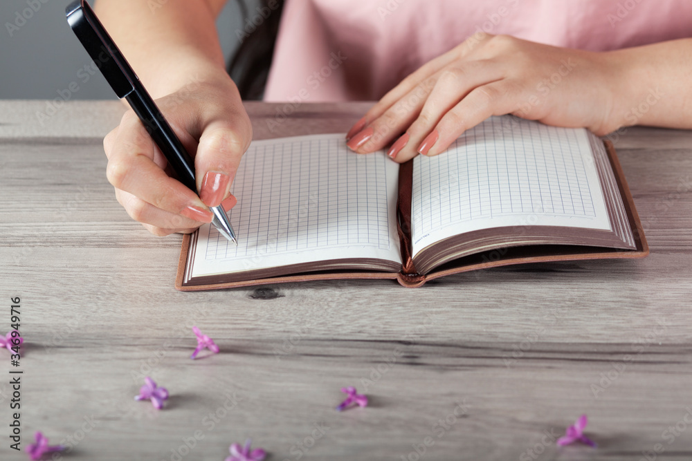 woman hand pen with notepad woman hand pen with notepad