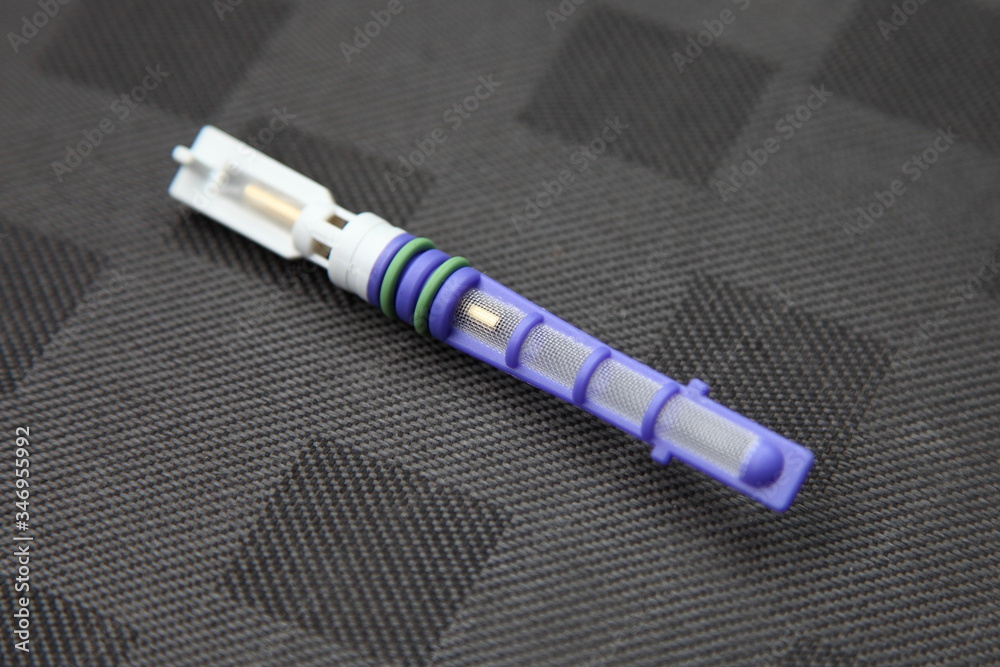 New orifice tube replaceable valve cartridge for car conditioner closeup, automotive A/C service