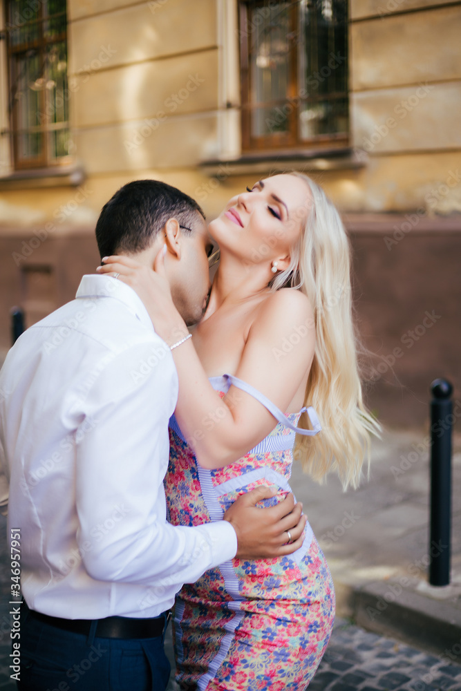 woman with her husband walking around the city, dressed neatly woman with her husband walking around the city, dressed neatly