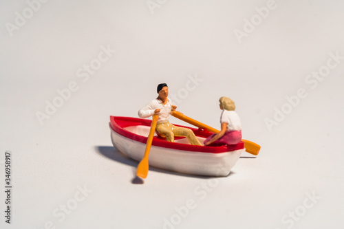 miniature figure of kayaking, rowing the boat © lessysebastian