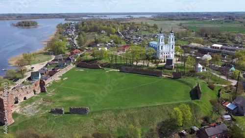 Aerial View of the Ludza Medieval Castle Ruins on a Hill Between Big Ludza Lake and Small Ludza Lake and the Roman Catholic Church in Background
 photo